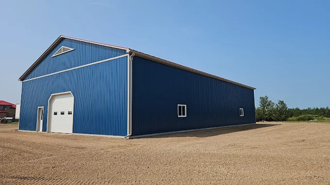 Long-span blue steel farm building with metal roof